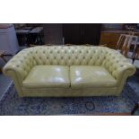 A mustard leather Chesterfield settee