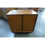 A teak two door record cabinet