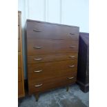 A teak chest of drawers