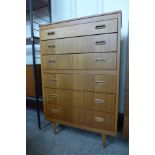 A teak chest of drawers