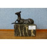 A small bronze figure of a deer, on grey marble socle, 15cms h