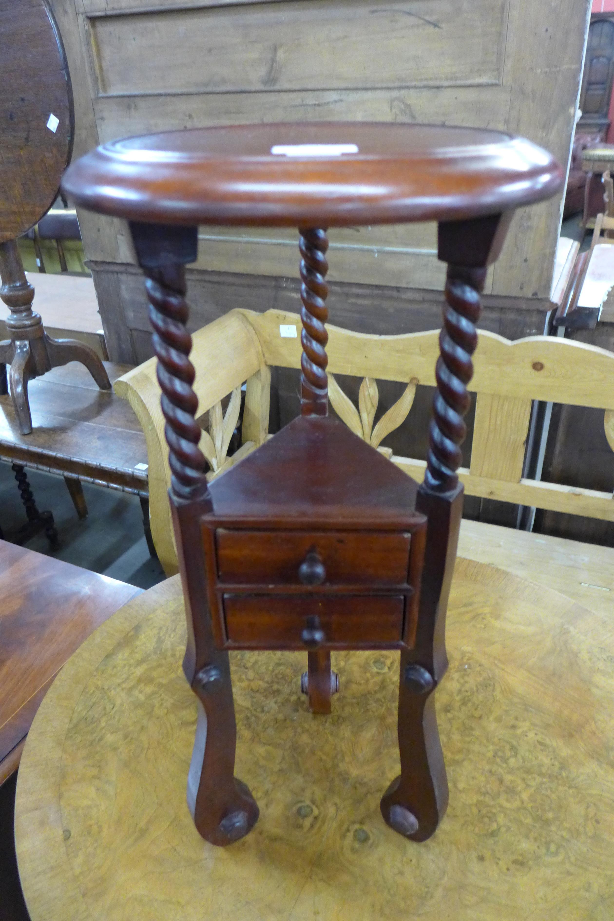 A mahogany jardiniere stand