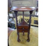 A mahogany jardiniere stand