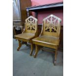 A pair of Victorian Gothic Revival carved oak hall chairs, manner of A.W.N. Pugin