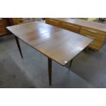 A teak extending dining table