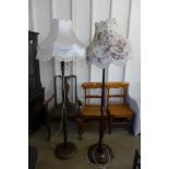 Two mahogany standard lamps