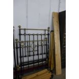 A Victorian wrought iron and brass single bed