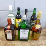 Seven bottles of spirits; Robillot, Gin, Bacardi, Stone's Ginger Wine, Curacao, Cointreau and