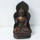 A bronze Tibetan Buddha and throne