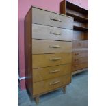 A teak chest of drawers