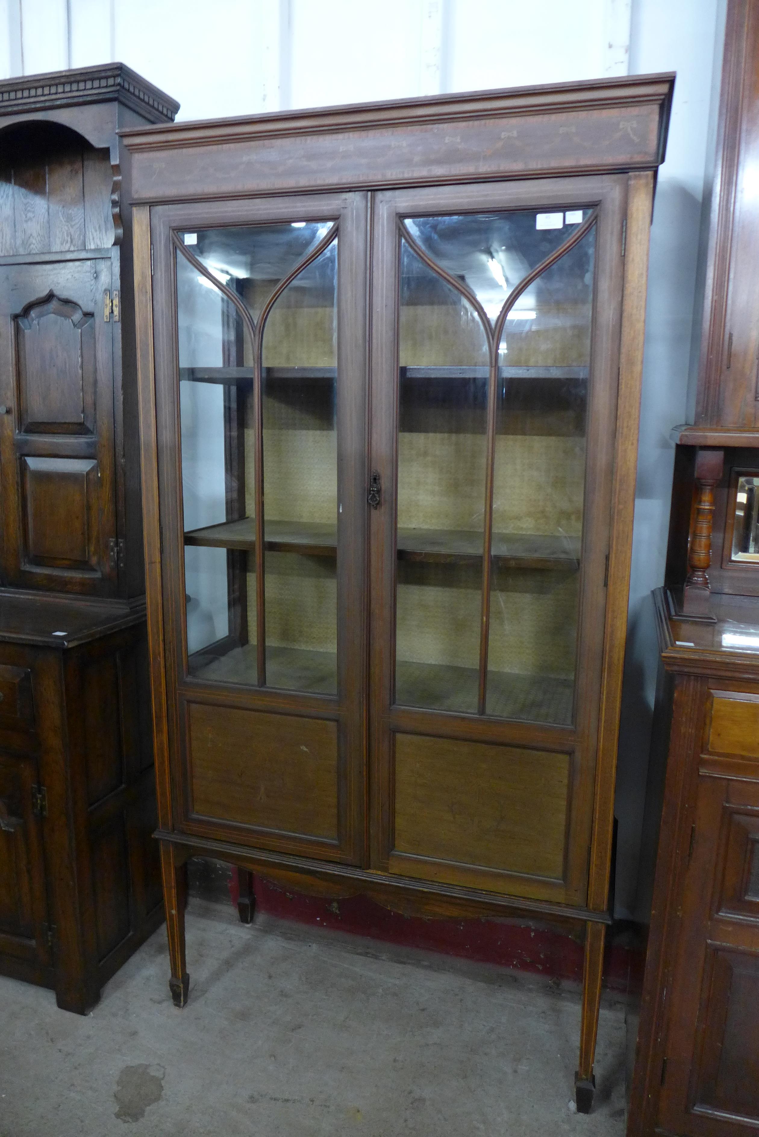 An Edward VII inlaid mahogany display cabinet