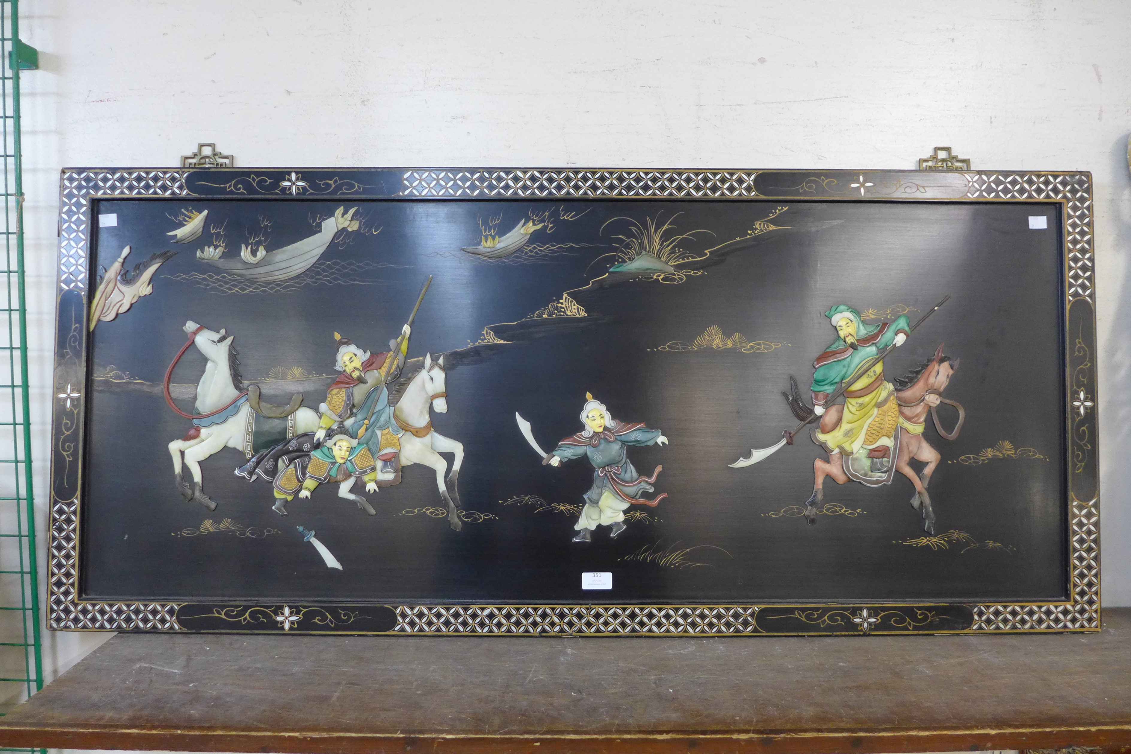 A Chinese lacquered and inlaid panel