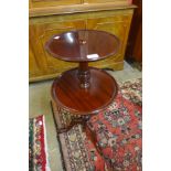 A George IV style mahogany circular two tier dumb waiter