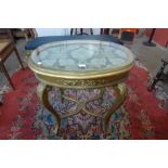 An Italian giltwood, gesso and glass topped oval centre table