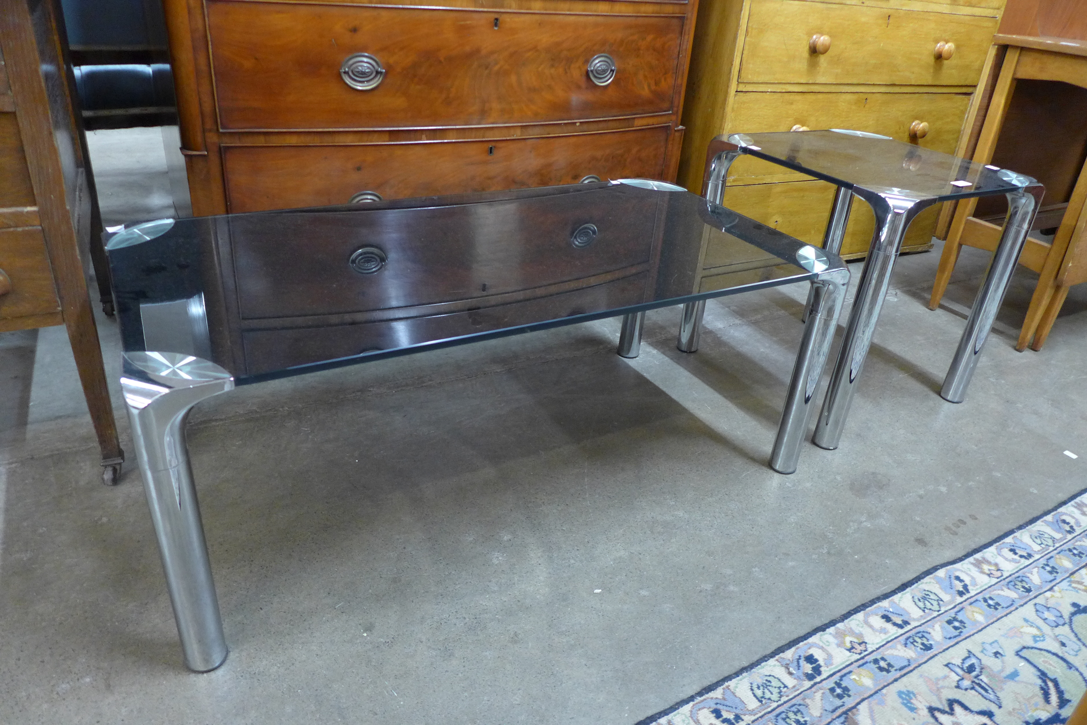 Two Italian chrome and smoked glass topped coffee tables