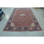 An eastern red ground rug, 300 x 205cms