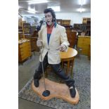 A large painted fibreglass figure of Elvis Presley, 183cms h