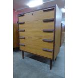 A teak chest of drawers