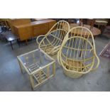 A pair of bamboo revolving chairs and a coffee table