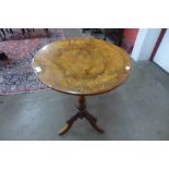 A Victorian burr walnut circular tripod table
