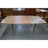 A McIntosh teak T2 extending dining table