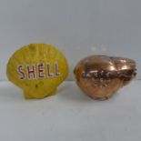 A cast Shell money bank and a copper pig money bank