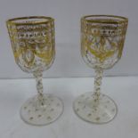 A pair of gilded continental wine glasses, circa 1850