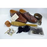 A pair of unworn Desborough shoes, 6½, studs, a leather belt, a leather wallet, a clothes brush