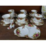 Six Royal Albert Old Country Roses cups, saucers and tea plates, a saucer/plate combination and a