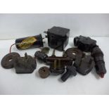 A collection of Bakelite; triple plug socket, two plugs, Airclipse Auto-Inductive aerial, light