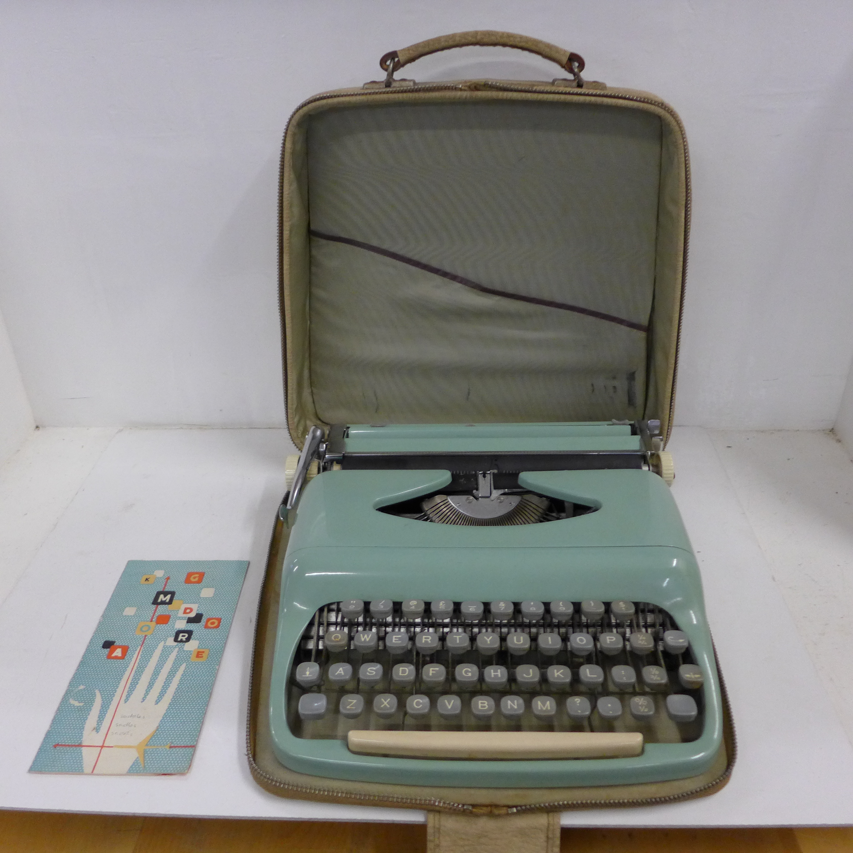 A blue typewriter in case