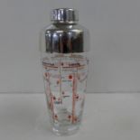 A mid 20th Century glass and chrome cocktail shaker with cocktail instructions