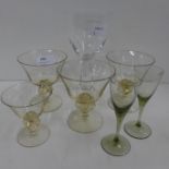 A set of three Swedish Skruff Champagne sherbet glasses, one other Skruff glass and three others