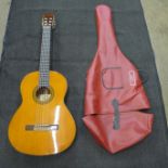 A Yamaha G235 acoustic guitar with soft case