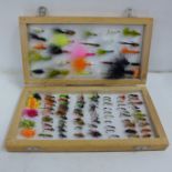 One hundred assorted trout flies, barbed