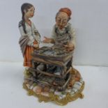 A Capodimonte cobbler figure group