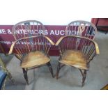 A pair of similar 19th Century elm and beech Windsor armchairs