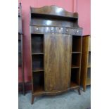 A George III style mahogany breakfront bookcase