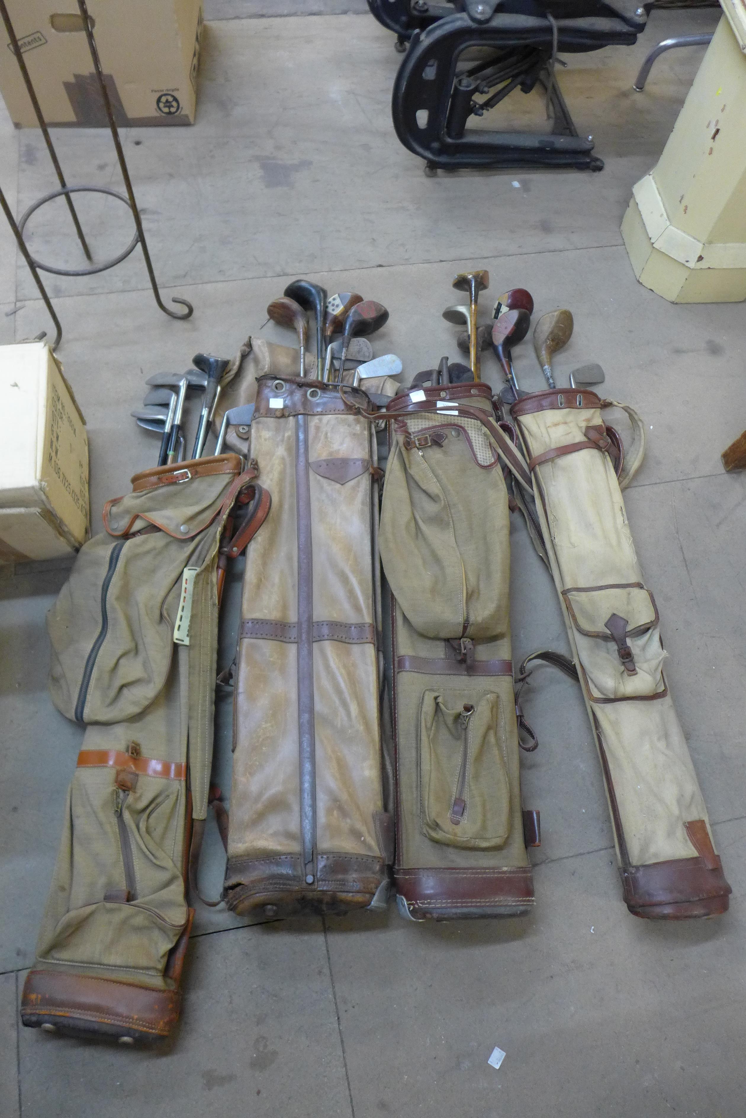 Four vintage golf bags and clubs
