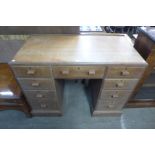 An Art Deco oak desk, attributed to Heals, London