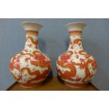 A pair of Chinese ironstone red and white porcelain vases