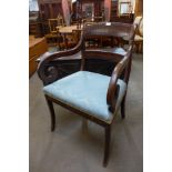 An 18th Century Dutch mahogany and marquetry inlaid elbow chair