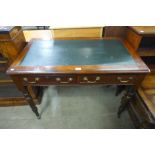 A Victorian mahogany two drawer writing table