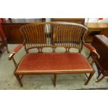 An Edward VII inlaid mahogany salon settee