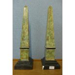 A pair of plaster faux marble obelisks, a/f