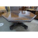 A large Victorian carved oak octagonal centre table