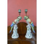 A pair of French style painted porcelain and gilt metal mounted parrot candlesticks
