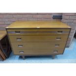 A teak chest of drawers