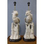 A pair of French style white porcelain parrot table lamps