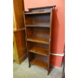 A small Arts and Crafts oak open bookcase